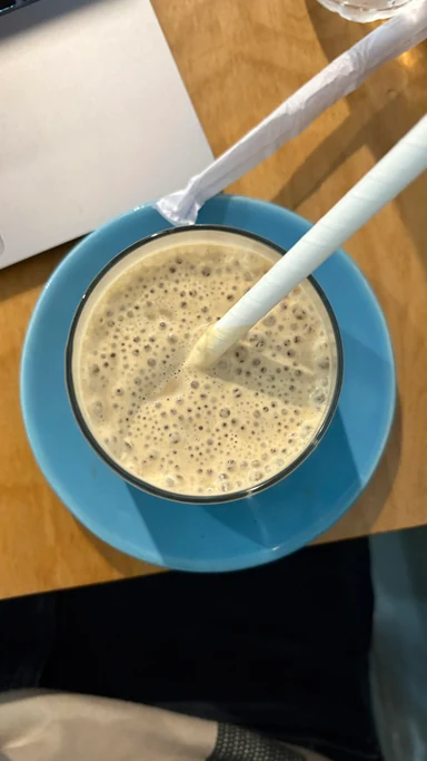 Coffee in a blue saucer on the studio desk
